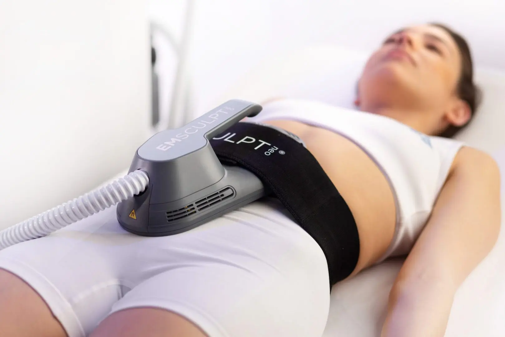 Woman receiving abdominal body-contouring treatment