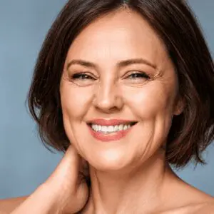 Smiling woman with a warm, inviting expression.