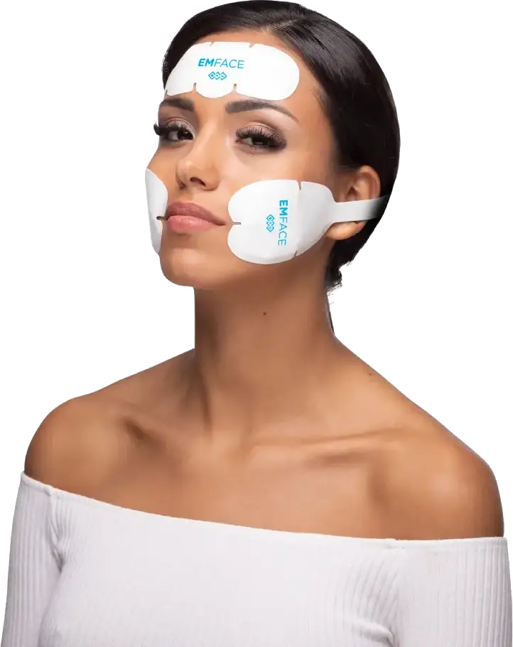 Emface skin treatment patches on a woman's face